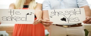 Bride and groom with signs L.A. Banquets