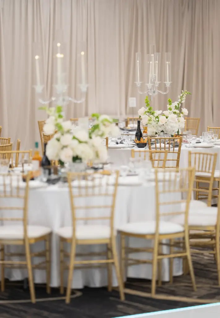 Candlelit table setting with crystal candelabras and a white floral centerpiece