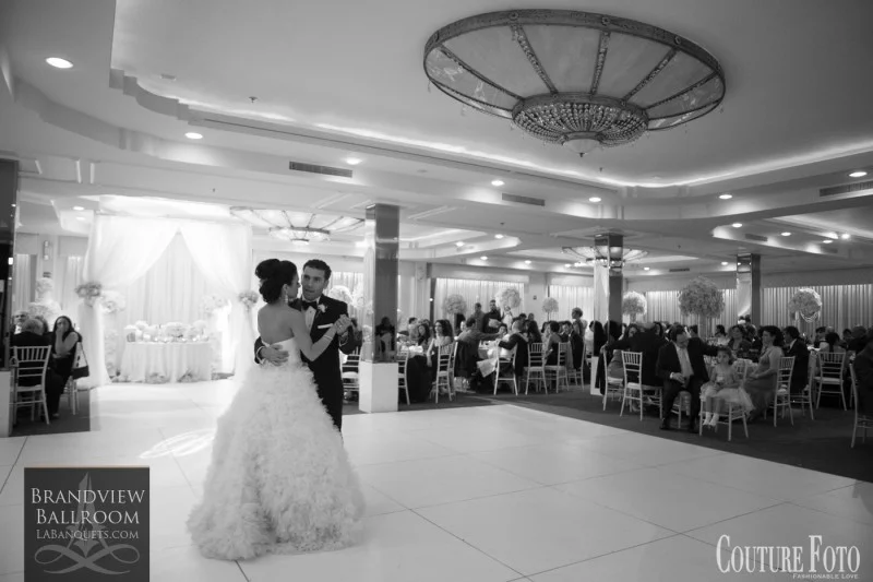 Black-and-white photo of bride and groom dancing at Brandview Ballroom