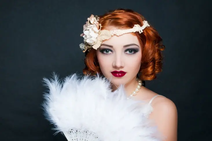 1920s style woman with fan