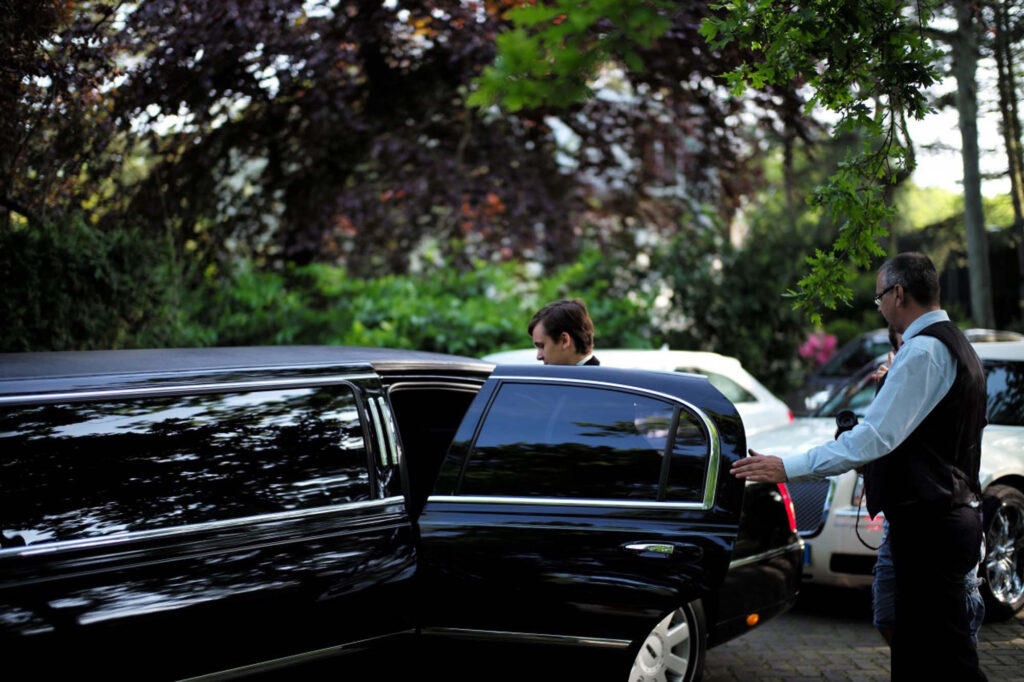 a person standing next to a car