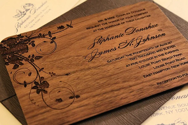 Wedding invitation engraved on a wood veneer card with a floral design