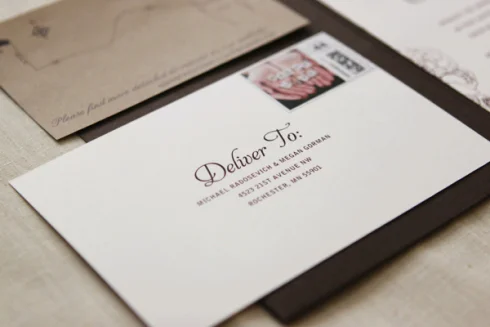 Vintage-style wedding invitation envelope with a postage stamp