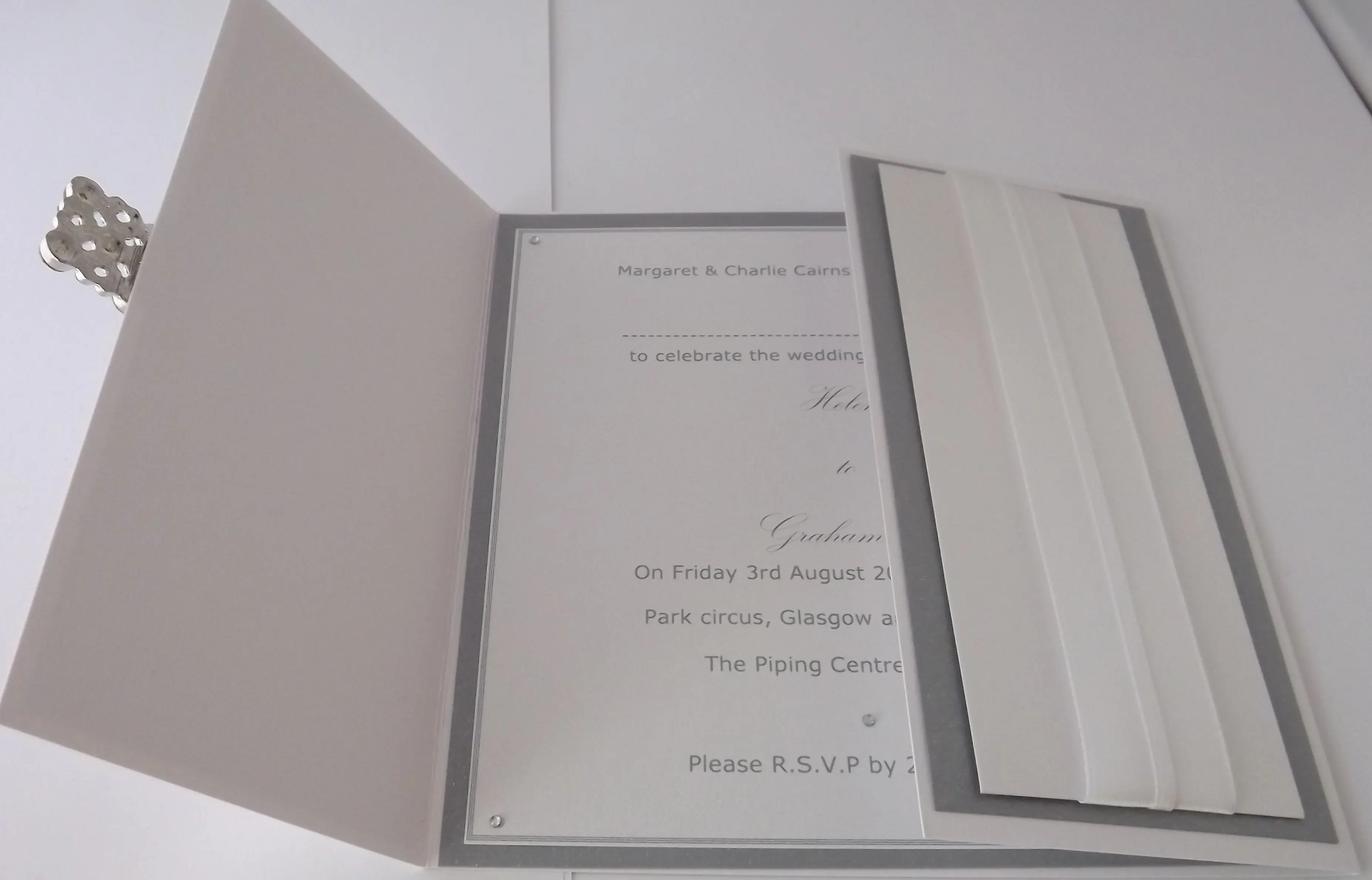 Gatefold wedding invitation opened to reveal the printed card inside