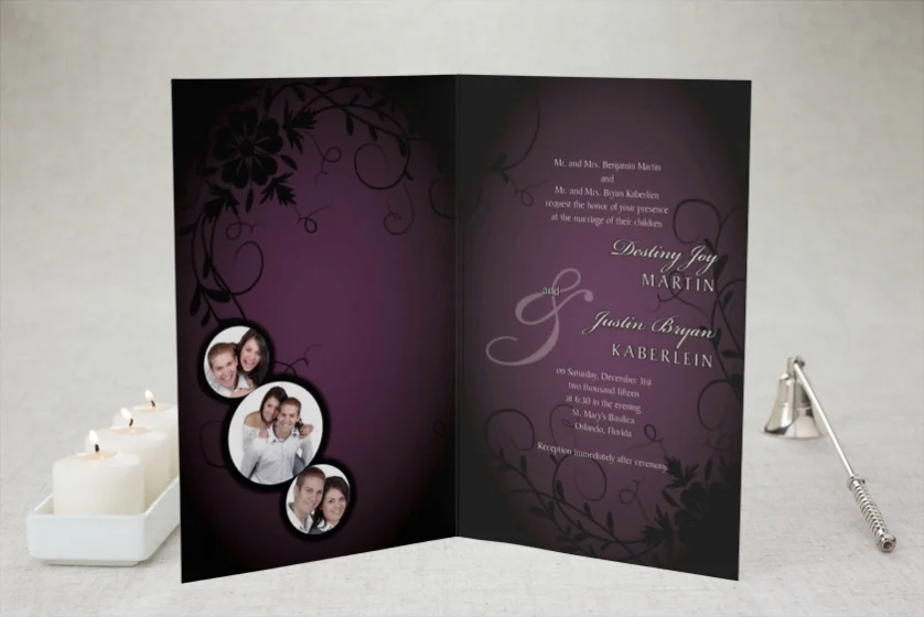 Purple folded wedding invitation with photo cutouts beside lit candles