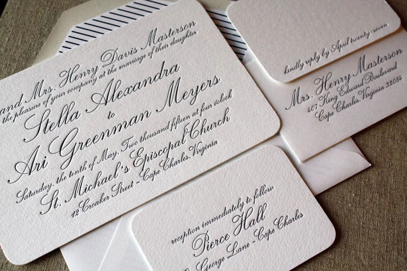 Letterpress wedding invitation suite with a striped envelope liner