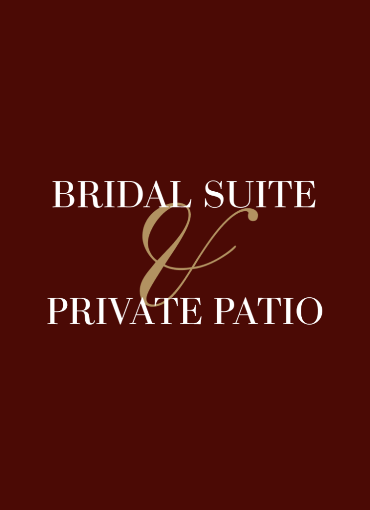 Bride and groom kissing in front of a fringe curtain backdrop and dessert table