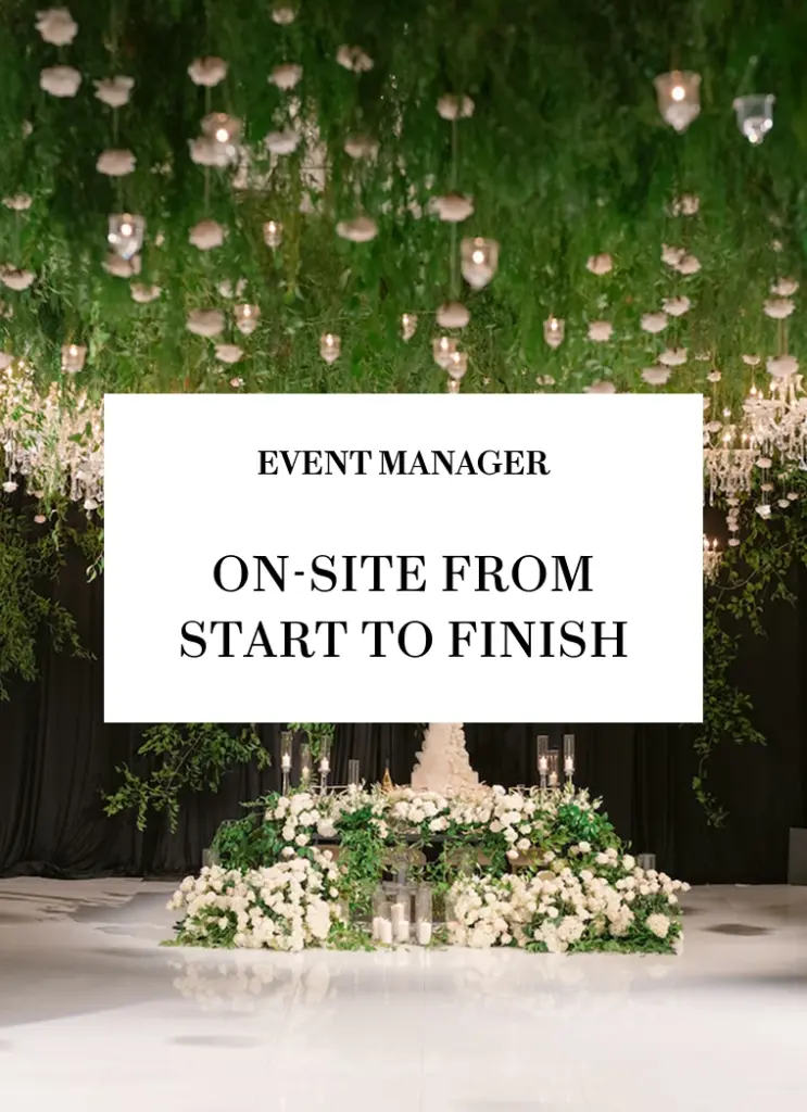 Event Manager service graphic over a floral and candle ceiling installation above a head table